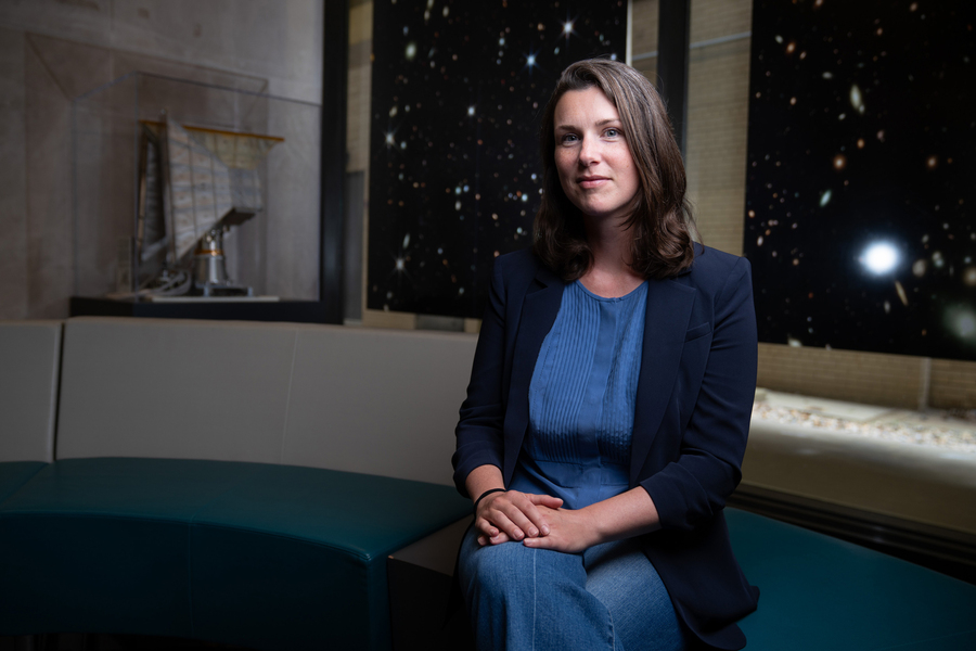 Erin Kara sits in the lobby of MIT Building 37