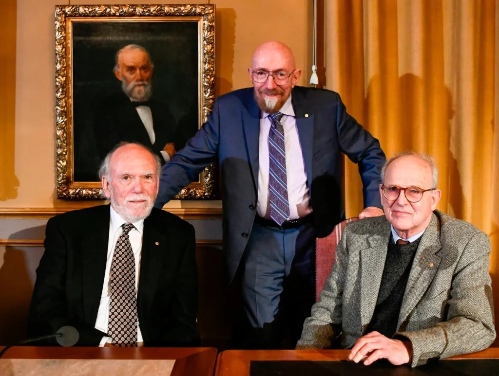 Dr. Weiss, right, with his fellow recipients of the 2017 Nobel Prize in Physics: Barry C. Barish, left, and Kip S. Thorne.