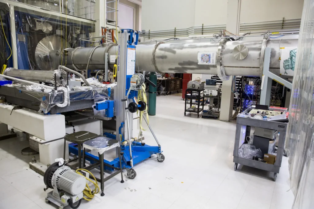 Inside the LIGO Lab at M.I.T. in 2018 showing the LIGO device and other lab equipment.