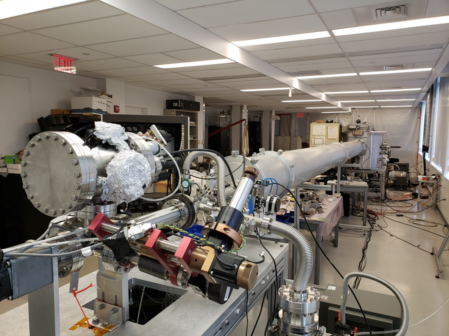 Photo of a long vacuum tube in a laboratory