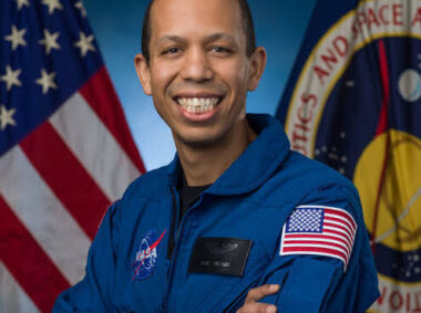 A photo of Chris Williams in his blue NASA flight suit.
