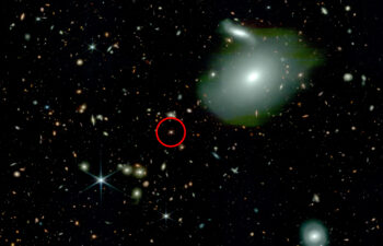 This image, taken by NASA’s James Webb Space Telescope, shows an ancient quasar (circled in red) with fewer than expected neighboring galaxies (bright spheres), challenging physicists’ understanding of how the first quasars and supermassive black holes formed.