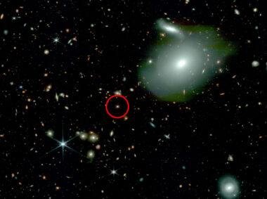 This image, taken by NASA’s James Webb Space Telescope, shows an ancient quasar (circled in red) with fewer than expected neighboring galaxies (bright spheres), challenging physicists’ understanding of how the first quasars and supermassive black holes formed.
