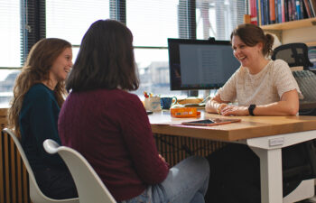 Professor Anna-Christina Eilers chats with two of her students.