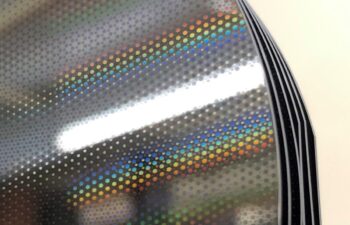 Silicon mirrors with stress correction patterns etched into a thermal oxide layer.